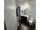 Modern bathroom with dark wood vanity, white sink and toilet at 3384 Corona Village Way # 108, Orlando, FL 32835