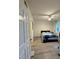 Spacious bedroom with a queen bed and double doors to closet at 3384 Corona Village Way # 108, Orlando, FL 32835