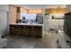 Modern kitchen with stainless steel appliances and island at 3384 Corona Village Way # 108, Orlando, FL 32835