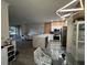 Modern kitchen with white cabinets, stainless steel appliances, and an island at 3384 Corona Village Way # 108, Orlando, FL 32835