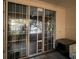 Screened balcony with view of lake and lush landscape at 3384 Corona Village Way # 108, Orlando, FL 32835