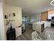 Open concept kitchen with white cabinets and a large island at 3384 Corona Village Way # 108, Orlando, FL 32835