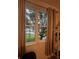 Window view of tranquil lake and tree-lined landscape at 3384 Corona Village Way # 108, Orlando, FL 32835