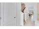 Bright hallway with tile flooring, leading to staircase and living area at 2204 Tongass Bnd, Davenport, FL 33837