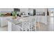 Modern kitchen with island seating and granite countertops at 2204 Tongass Bnd, Davenport, FL 33837