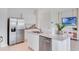Modern kitchen with stainless steel appliances and white cabinetry at 2204 Tongass Bnd, Davenport, FL 33837