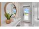 Entryway with a large mirror and view to the front yard at 2204 Tongass Bnd, Davenport, FL 33837