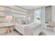 Charming bedroom with a striped accent wall and a queen-size bed at 2204 Tongass Bnd, Davenport, FL 33837