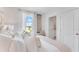 Bright bedroom featuring a comfortable bed and large window at 2204 Tongass Bnd, Davenport, FL 33837