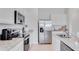 Modern kitchen with stainless steel appliances and granite countertops at 2204 Tongass Bnd, Davenport, FL 33837