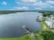 Aerial view of a waterfront area with boat docks and a calm lake at 9000 Us Highway 192 # 290, Clermont, FL 34714