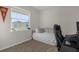 Bedroom with a daybed, workspace, and large window at 212 Golden Sands Cir, Davenport, FL 33837