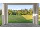 Covered patio overlooking a grassy backyard at 212 Golden Sands Cir, Davenport, FL 33837