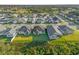 Aerial view of a neighborhood with many houses at 212 Golden Sands Cir, Davenport, FL 33837