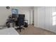 Bedroom featuring a workspace and ample closet space at 212 Golden Sands Cir, Davenport, FL 33837