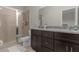 Bathroom features a large shower, granite vanity, and modern fixtures at 212 Golden Sands Cir, Davenport, FL 33837