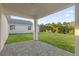 Covered patio with a view of the backyard at 212 Golden Sands Cir, Davenport, FL 33837