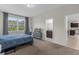 Spacious bedroom with ensuite bathroom and view of kitchen at 212 Golden Sands Cir, Davenport, FL 33837