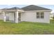 House exterior showcasing backyard and patio at 212 Golden Sands Cir, Davenport, FL 33837