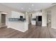 Modern kitchen with white cabinets, stainless steel appliances, and a breakfast bar at 11045 Belmere Isles Ct, Windermere, FL 34786