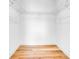 Walk-in closet with wire shelving and light wood flooring at 131 E Grant, Orlando, FL 32806