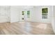Bright and airy living room with light hardwood floors and plenty of natural light at 131 E Grant, Orlando, FL 32806