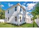 Modern two-story home with landscaped lawn and white exterior at 131 E Grant, Orlando, FL 32806