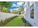 Landscaped backyard with freshly cut lawn at 131 E Grant, Orlando, FL 32806