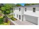 Two-story home with white siding and attached garage at 131 E Grant, Orlando, FL 32806