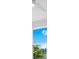Window showcasing a view of a bright blue sky and lush trees at 131 E Grant, Orlando, FL 32806
