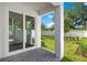 Backyard patio with sliding glass doors and fenced yard at 131 E Grant, Orlando, FL 32806