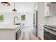 Modern kitchen with island, quartz countertops and gold fixtures at 131 E Grant, Orlando, FL 32806