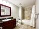 Clean bathroom with dark vanity, tub shower combo, and tile flooring at 14501 Grove Resort Ave # 1507, Winter Garden, FL 34787