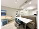 Built-in dining area with seating for four and modern lighting at 14501 Grove Resort Ave # 1507, Winter Garden, FL 34787
