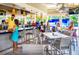Relaxing community bar with seating and bartenders making drinks at 14501 Grove Resort Ave # 1507, Winter Garden, FL 34787