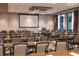 Ample meeting space with tables, chairs and projector at 14501 Grove Resort Ave # 1507, Winter Garden, FL 34787