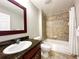 Small bathroom with tub, shower, and dark wood vanity at 14501 Grove Resort Ave # 1507, Winter Garden, FL 34787