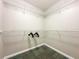 Spacious walk-in closet with wire shelving and carpeting at 14501 Grove Resort Ave # 1507, Winter Garden, FL 34787