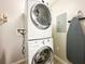 Laundry closet with stackable washer and dryer at 14501 Grove Resort Ave # 1507, Winter Garden, FL 34787
