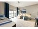 Living room with sectional sofa, balcony access, and city views at 14501 Grove Resort Ave # 1507, Winter Garden, FL 34787