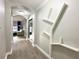 Stylish hallway with gray walls and floating shelves at 14501 Grove Resort Ave # 1507, Winter Garden, FL 34787