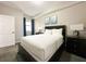 Comfortable bedroom with a double bed and plenty of natural light at 14501 Grove Resort Ave # 1507, Winter Garden, FL 34787