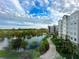 Luxury condo community with lake, walking paths, and resort-style amenities at 14501 Grove Resort Ave # 1507, Winter Garden, FL 34787