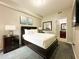 Spacious bedroom with double bed, nightstand, and large window at 14501 Grove Resort Ave # 1507, Winter Garden, FL 34787