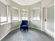 Cozy sitting area with comfortable chair and natural light at 14501 Grove Resort Ave # 1507, Winter Garden, FL 34787