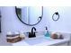 Modern bathroom vanity with sleek fixtures and ample counter space at 13356 Sw 64Th Street Rd, Ocala, FL 34482