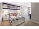 Nautical-themed bedroom with white bed frame and built-in closet at 1502 Isleta Loop, Kissimmee, FL 34741