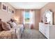 Charming bedroom with daybed, dresser, and window with curtains at 1502 Isleta Loop, Kissimmee, FL 34741