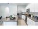 Modern kitchen with stainless steel appliances and granite countertops at 1502 Isleta Loop, Kissimmee, FL 34741