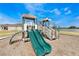Community playground with double slide and playset at 1502 Isleta Loop, Kissimmee, FL 34741